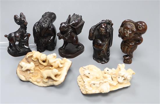 Two mammoth ivory carved groups and five wood netsuke (7)